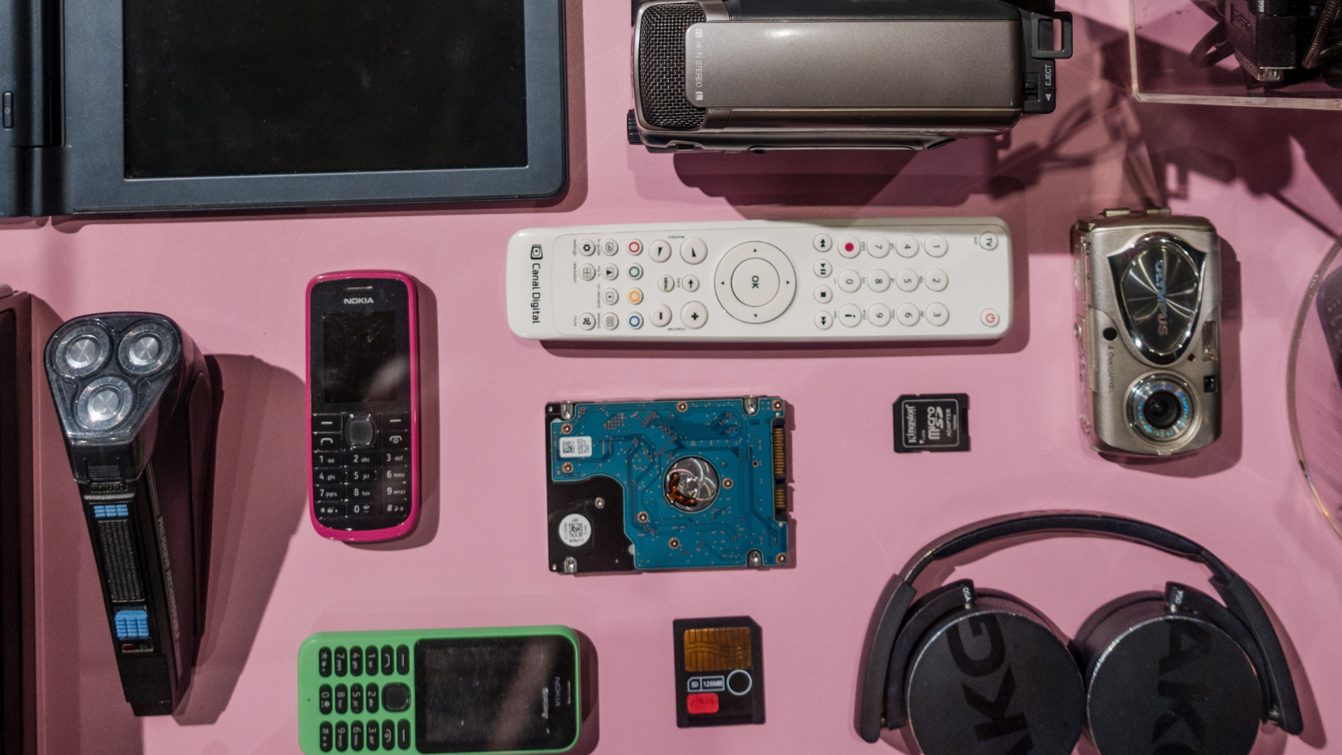 a pink background with the vintage tech that signals status